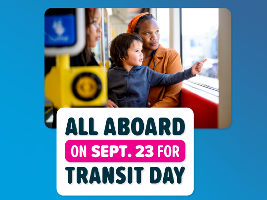Two people sitting on a bus