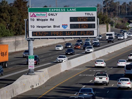 Picture of the freeway and express lanes sign with cars