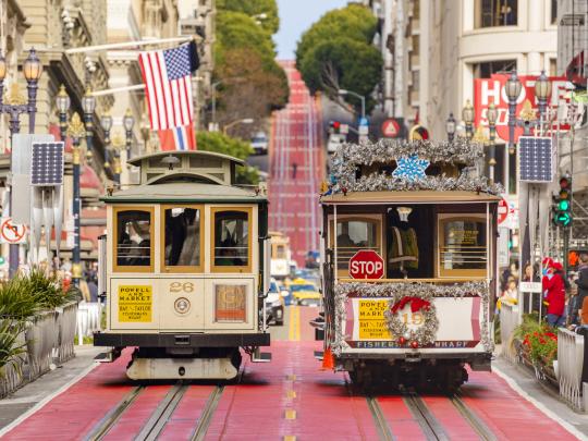 Two cable cars side by side decorated for Christmas