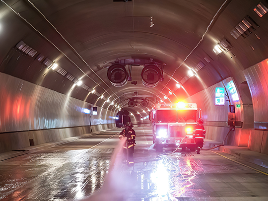 Firetruck and firefighter in a tunnel