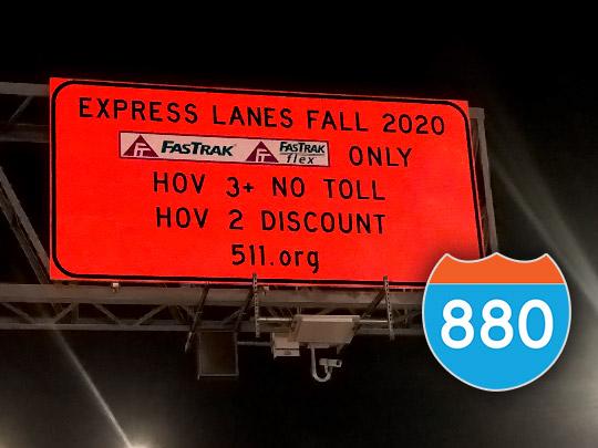 Orange FWY sign saying "EXPRESS LANES FALL 2020; FasTrak ONLY; HOV 3+ NO TOLL; HOV 2 DISCOUNT; 511.org