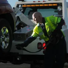 Technician towing vehicle
