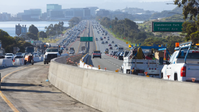 Picture of the us-101 freeway with cars and the city in the background