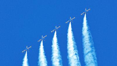 Picture of airplanes flying upwards in the sky