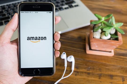 Person shopping on Amazon by mobile phone