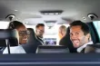 A group of people sharing a car ride.
