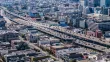 top view of a large city with two streets full of cars