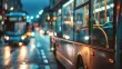 Buses driving through a city street at night