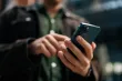 person looking at their cell phone