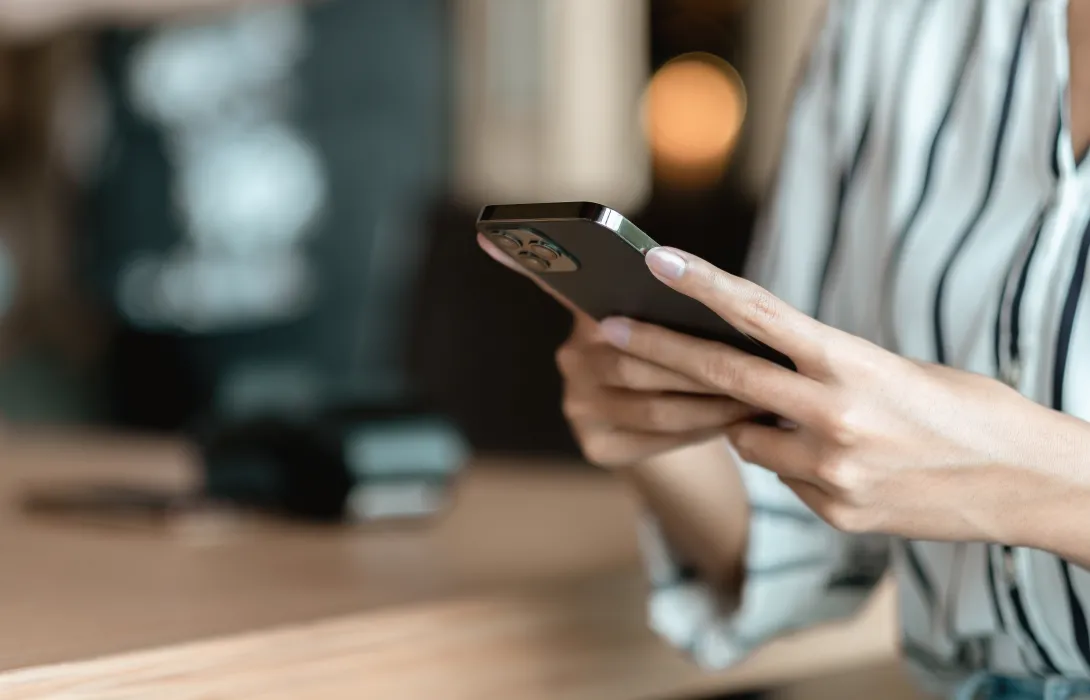 person looking at their cell phone