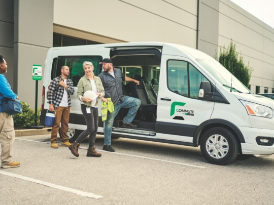 Group of people entering an Enterprise commute van.